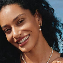 Load image into Gallery viewer, Gold Sparkle Twisted Huggie Hoop Earrings