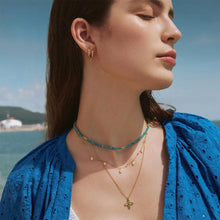 Load image into Gallery viewer, Gold Sparkle Twisted Huggie Hoop Earrings
